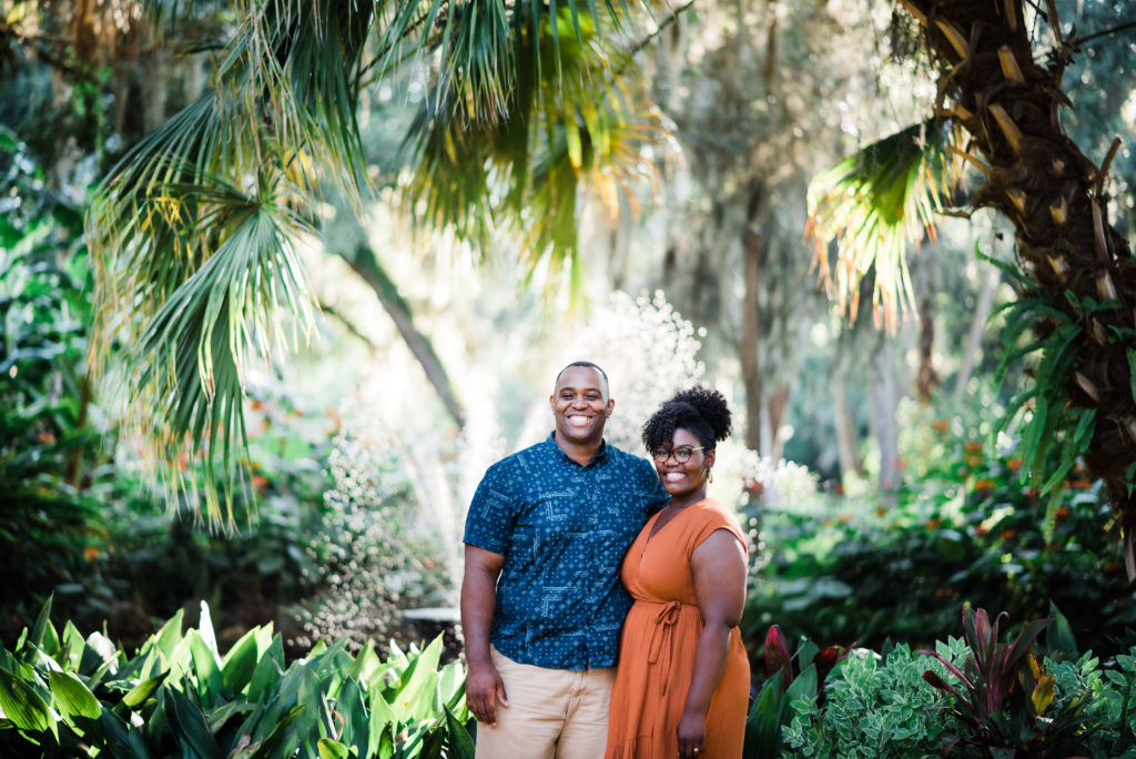 beautiful engagement photos on gravel sidewalks at Washington Oaks Garden State Park in Palm Coast Florida after surprise proposal Photo by Black Tie & Co. (www.btcweddings.com)