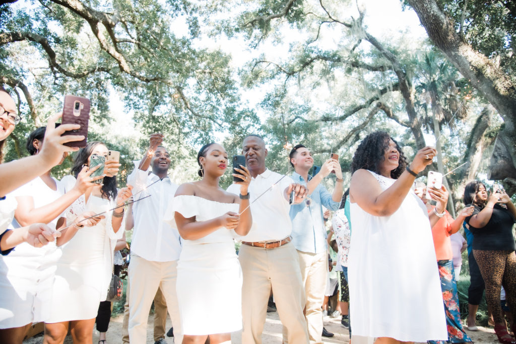 family looking on as the proposal unfolded. Washington Oaks Garden State Park surprise proposal Photo by Black Tie & Co. (www.btcweddings.com)