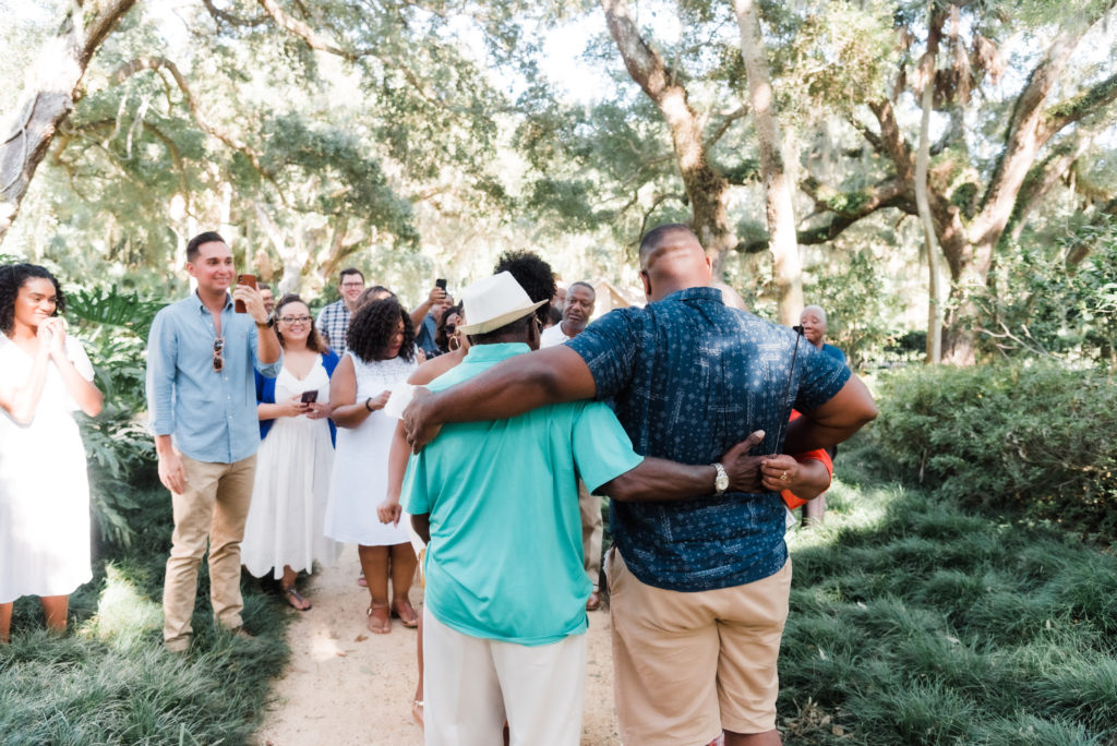 celebrating with family after the Washington Oaks Garden State Park surprise proposal Photo by Black Tie & Co. (www.btcweddings.com)