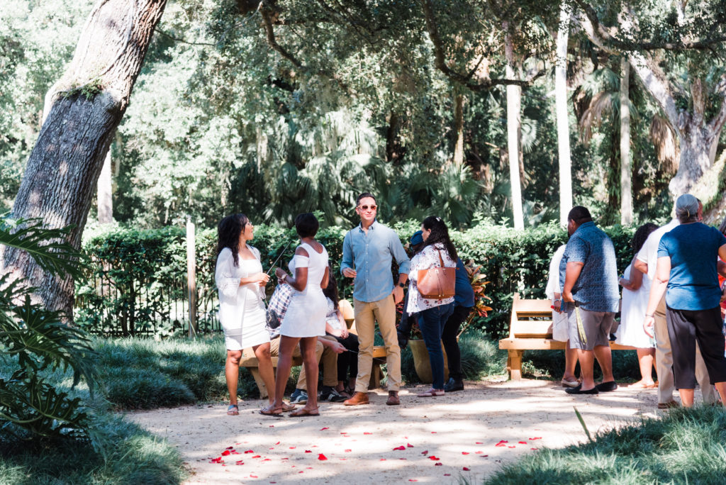 Family gathering at Washington Oaks Garden State Park minutes before the surprise proposal Photo by Black Tie & Co. (www.btcweddings.com)