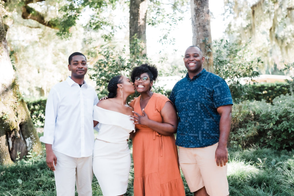 celebrating with family after the Washington Oaks Garden State Park surprise proposal Photo by Black Tie & Co. (www.btcweddings.com)