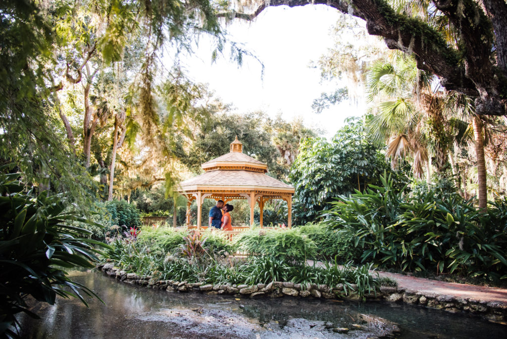 couple under the gazebo mini engagement session at Washington Oaks Garden State Park after surprise proposal Photo by Black Tie & Co. (www.btcweddings.com)