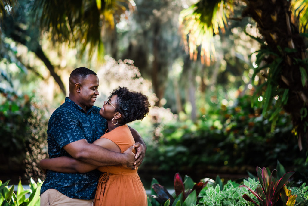 beautiful engagement photos on gravel sidewalks at Washington Oaks Garden State Park in Palm Coast Florida after surprise proposal Photo by Black Tie & Co. (www.btcweddings.com)