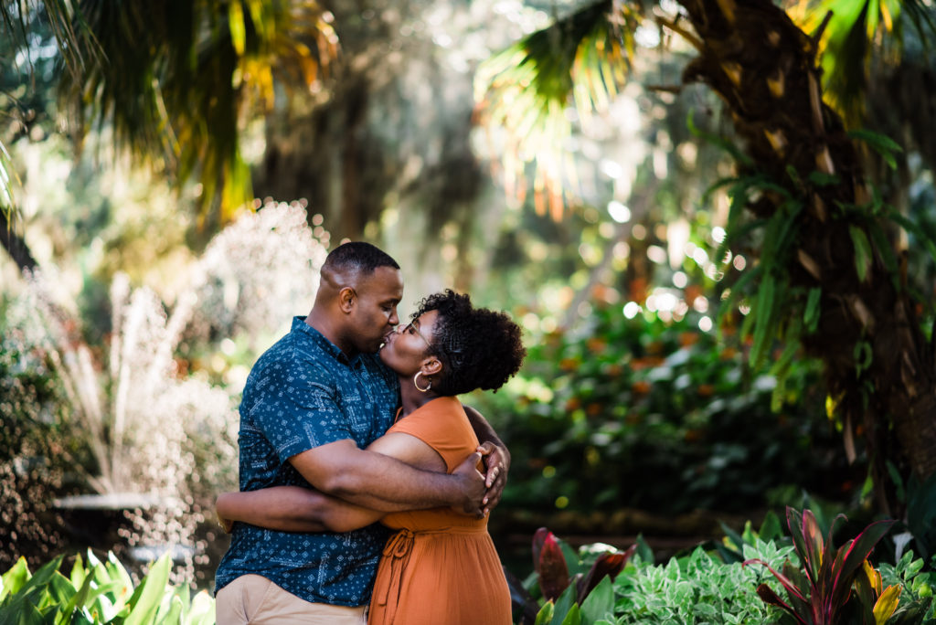 beautiful engagement photos on gravel sidewalks at Washington Oaks Garden State Park in Palm Coast Florida after surprise proposal Photo by Black Tie & Co. (www.btcweddings.com)