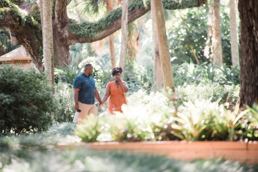 As soon as Bri walked around the corner she saw her family waiting for her when Kris would get down on one knee.  Washington Oaks Garden State Park minutes before the surprise proposal Photo by Black Tie & Co. (www.btcweddings.com)