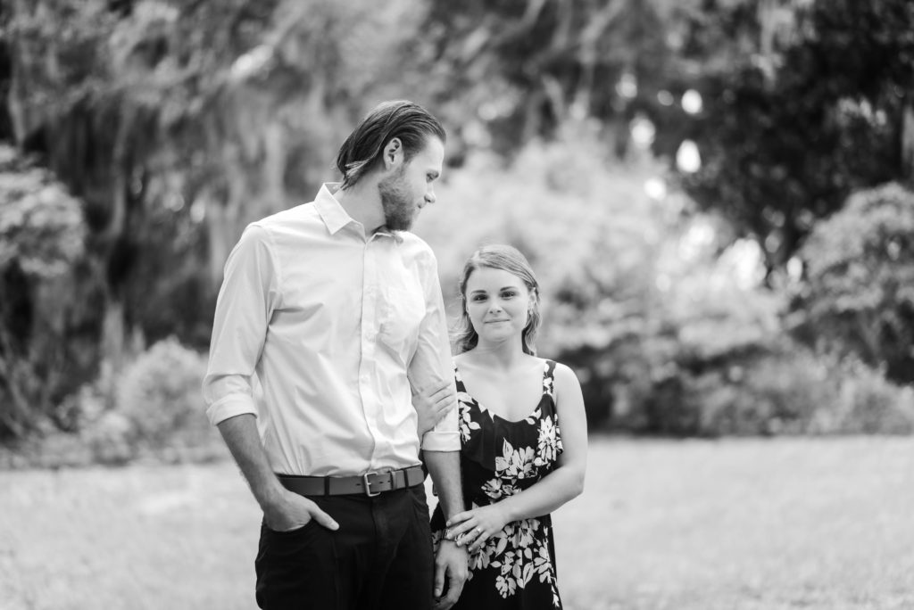 couples engagement photo in front of the Bennett House,  Alpine Groves Park. in Jacksonville Florida  Photo By Black Tie & Co. www.btcweddings.com