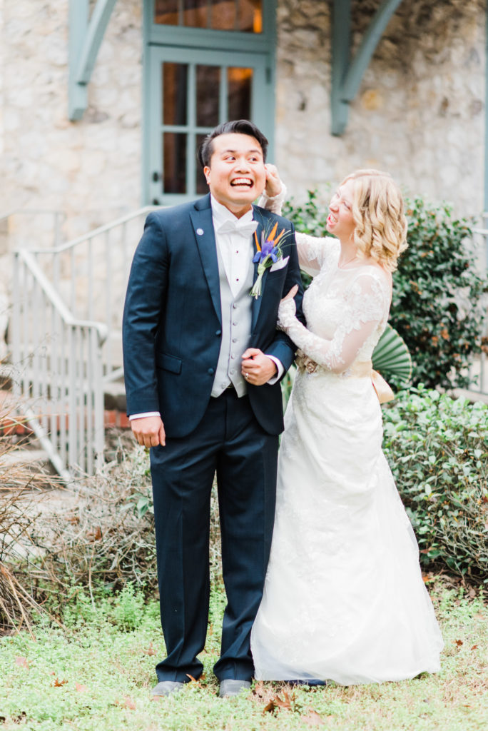 Bride and groom being silly during their portraits Photo by: Black Tie & Co. (www.btcweddings.com)